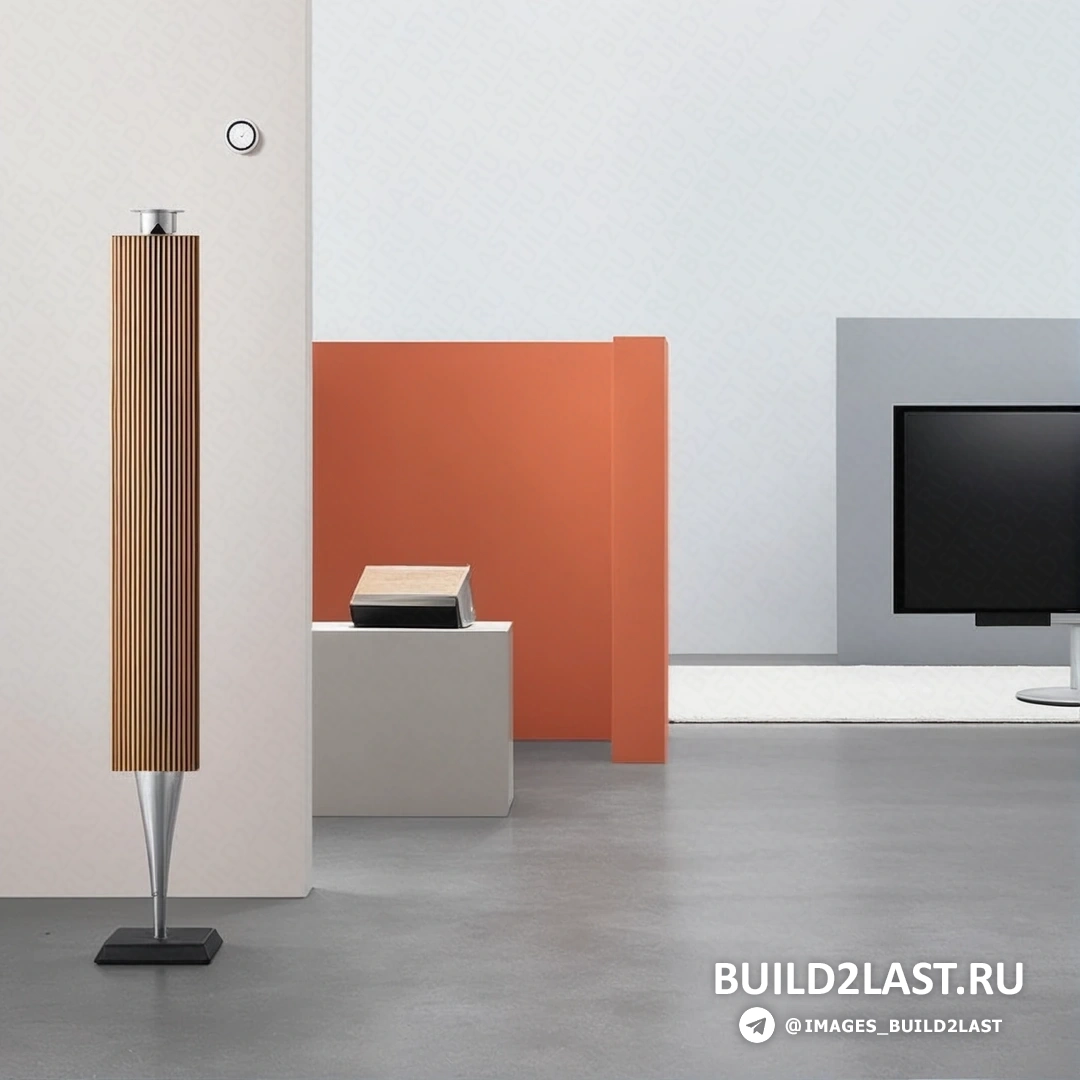 Диван, стулья и декоративные элементы в скандинавском стиле с акустической системой Beoplay A9 в черном цвете, создают уютную гостиную в Дании.